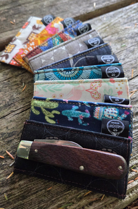 Collection of colorful phone cases on a wooden surface