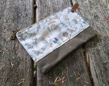 Fabric pouch with floral pattern on a wooden surface