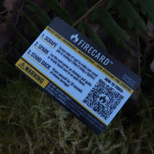Firecard device on a grassy surface with a QR code visible