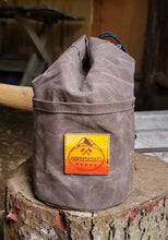 Waxed canvas bucket bag with ombre leather patch