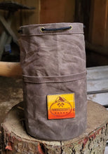 Waxed canvas bucket bag with ombre leather patch