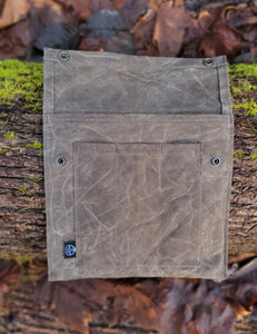 Flat Laying Waxed Canvas bag designed to hold outdoor gear