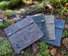 Waxed Multiple canvas bags designed to hold outdoor gear